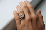 Oval cut lab diamond engagement ring with double pave band