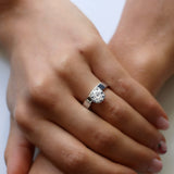 Round cut engagement ring with white gold cigar band