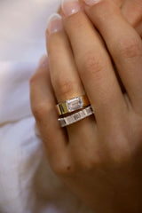 Deltora Diamonds Half Bezel Set Emerald Diamond Cigar Band Engagement Ring made from Sustainable Lab Diamonds.